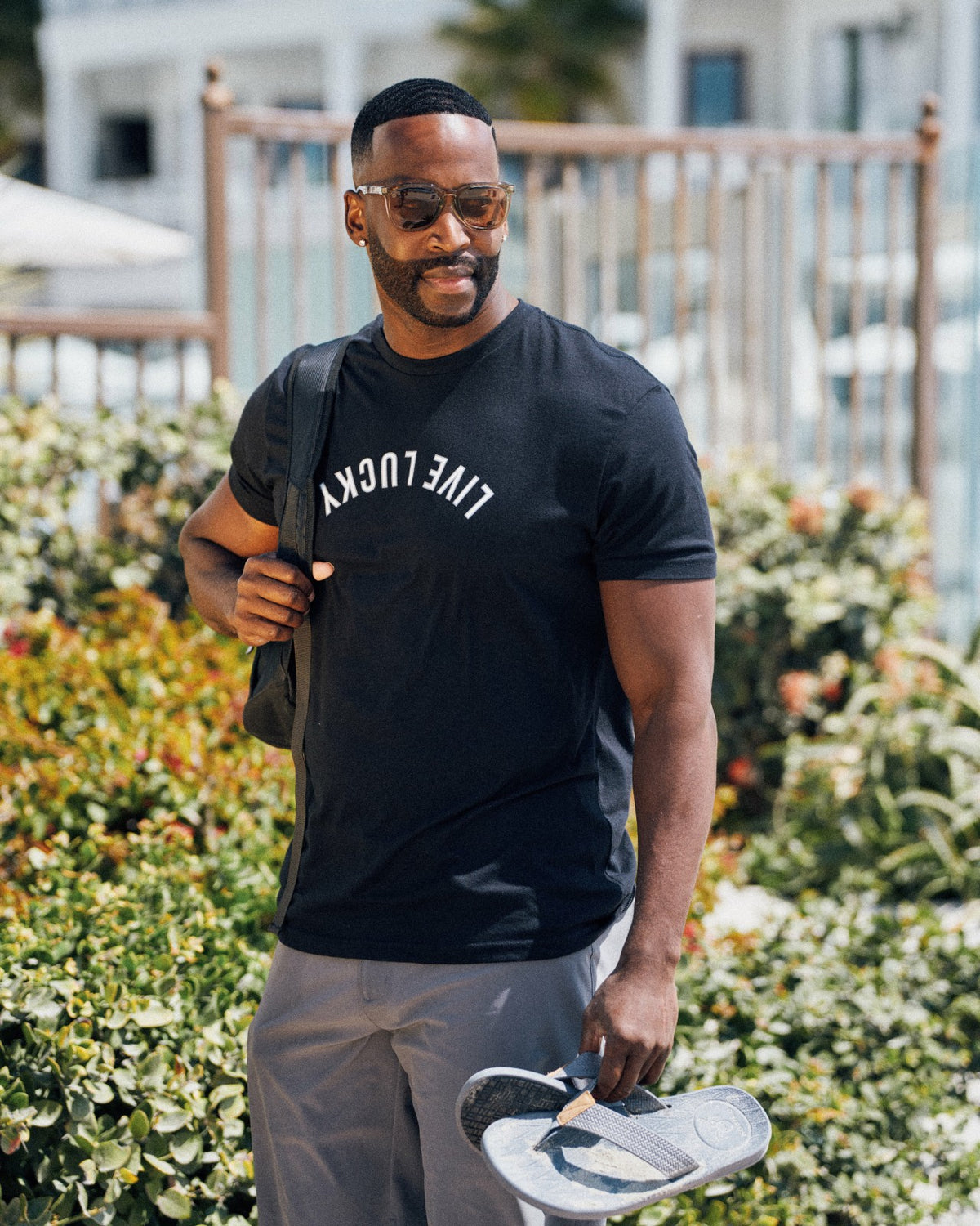Retro Men's Black Graphic Tee with Upside Down Live Lucky Logo