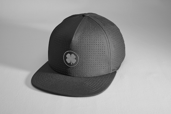 Black Perforated Flatbrim Hat with Silver Clover